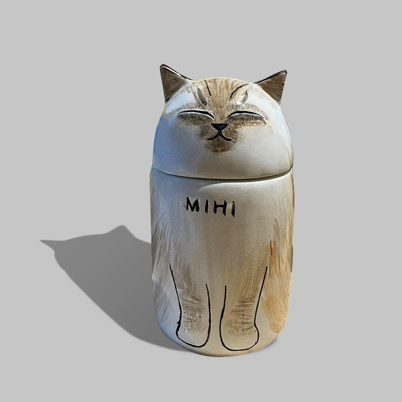 Custom handmade ceramic pet urn with cat photo and engraved name.