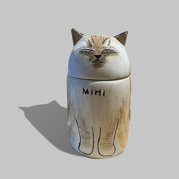 Custom handmade ceramic pet urn with cat photo and engraved name.